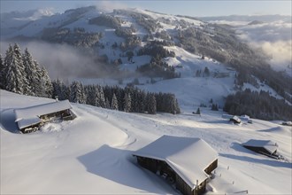 Snowy mountain huts in winter