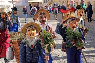 Typical masks in the Maschkera procession at carnival
