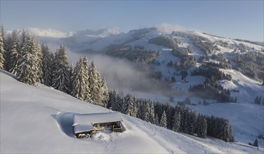 Snowy mountain hut in winter