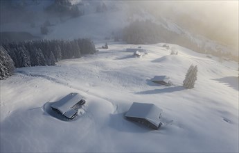 Snowy mountain huts in winter