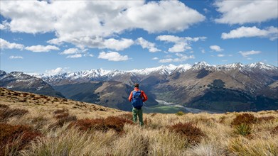 Hiker on the summit of Mount Alfred