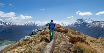 Hiker on the summit of Mount Alfred