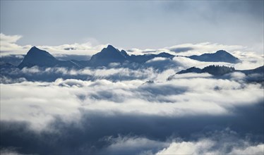 View of mountains between clouds