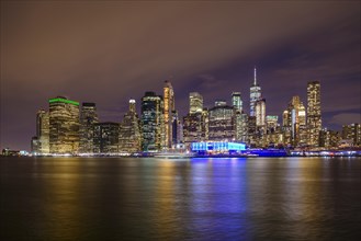 View from Pier 1 at night over the East River to the skyline of lower Manhattan