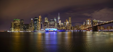 View from Pier 1 at night over the East River to the skyline of lower Manhattan