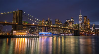 View from Main Street Park at night over the East River to the skyline of lower Manhattan