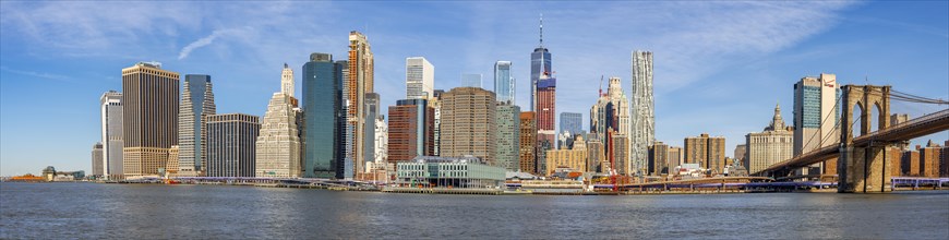 View from Pier 1 over the East River to the skyline of Lower Manhattan with Brooklyn Bridge