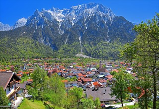 View of the town in front of the Karwendel Mountains with Viererspitze
