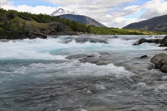 Rapids at the confluence of blue Baker river and grey Neff river