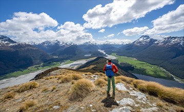 Hiker on the summit of Mount Alfred