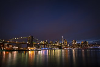 View from Main Street Park at night over the East River to the skyline of lower Manhattan