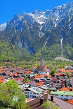 View of the town in front of the Karwendel Mountains with Viererspitze