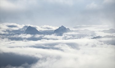 View of mountains between clouds
