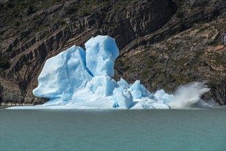 An iceberg breaks apart