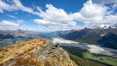 Hiker on the summit of Mount Alfred