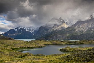 View over Lake Nordenskjoeld to the mountain range Cuernos del Paine in clouds
