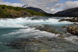 Rapids at the confluence of blue Baker river and grey Neff river