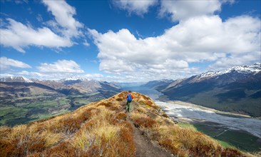 Hiker on the summit of Mount Alfred