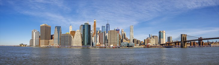 View from Pier 1 over the East River to the skyline of Lower Manhattan with Brooklyn Bridge