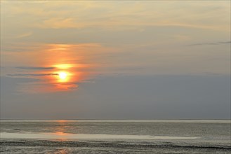 Sunset at the Wadden Sea at low tide