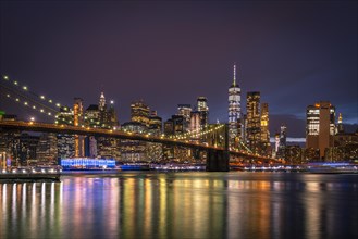 View from Main Street Park at night over the East River to the skyline of lower Manhattan