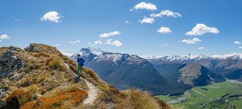 Hiker on the summit of Mount Alfred