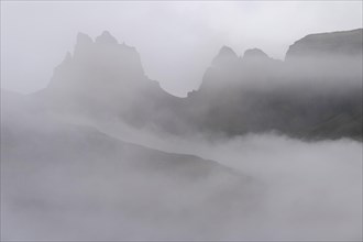 Cloud-covered rugged mountain peaks