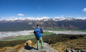 Hiker on the summit of Mount Alfred