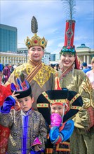 Mongolian family in traditional costumes in the DEEL