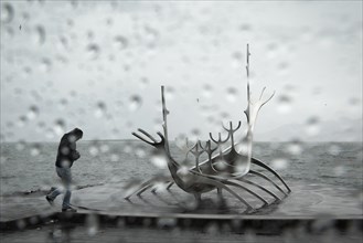 Tourist in rain at the sun ship