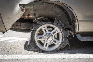 Car with destroyed tire