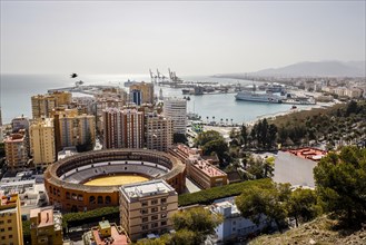 Bullfighting arena and the new harbour district with promenade Muelle Uno