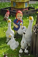 Garden gnomes from the fairy tale the goose maid with geese
