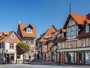 Alley with small half-timbered houses and cobblestones