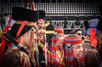 Young ladies in Mongolian traditional costumes at the Central square