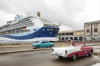 Cruise ship and US classic car from the 1950s at the cruise terminal of Havana