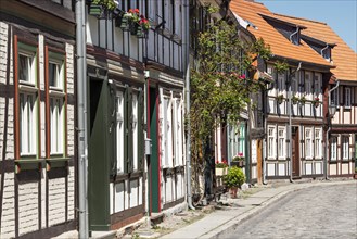 Alley with half-timbered houses and cobblestones