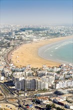 Modern architecture and sandy beach in Agadir