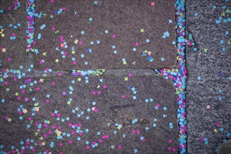 Colourful confetti after a carnival procession in the street
