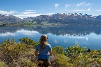 Young woman looking over Lake Wakatipu