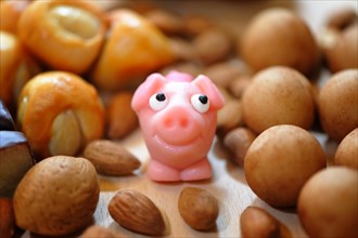 Pink marzipan pig with almonds
