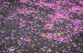 Colourful confetti after a carnival procession in the street