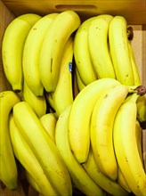 Bananas lying in a wooden box