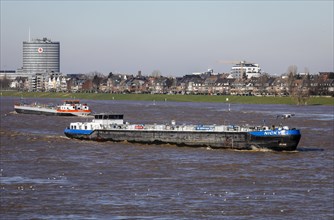 Freighters navigating on the Rhine during floods