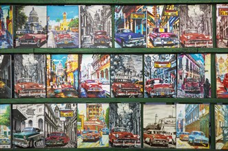 Retro style tin plaques of US classic cars at a souvenir stall