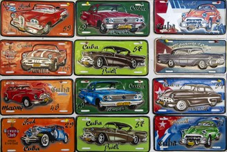 Retro style tin plaques of US classic cars in a souvenir shop