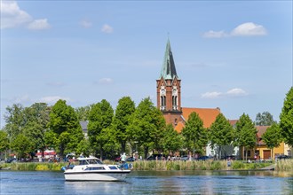 Motorboat on the Havel in front of the island church Maria Meeresstern