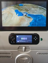 Screen showing flight position Dubai on backrest in aircraft