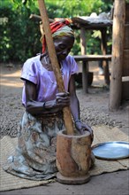 Woman prepares coffee