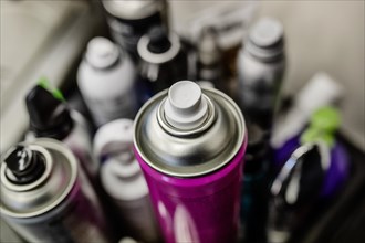 Cans with hairspray in hairdressing salon